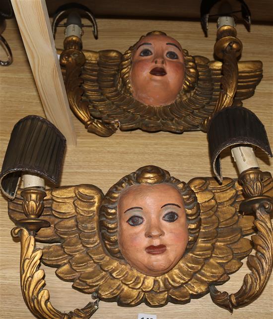 A pair of 2-branch angelic gilt painted wall sconces
